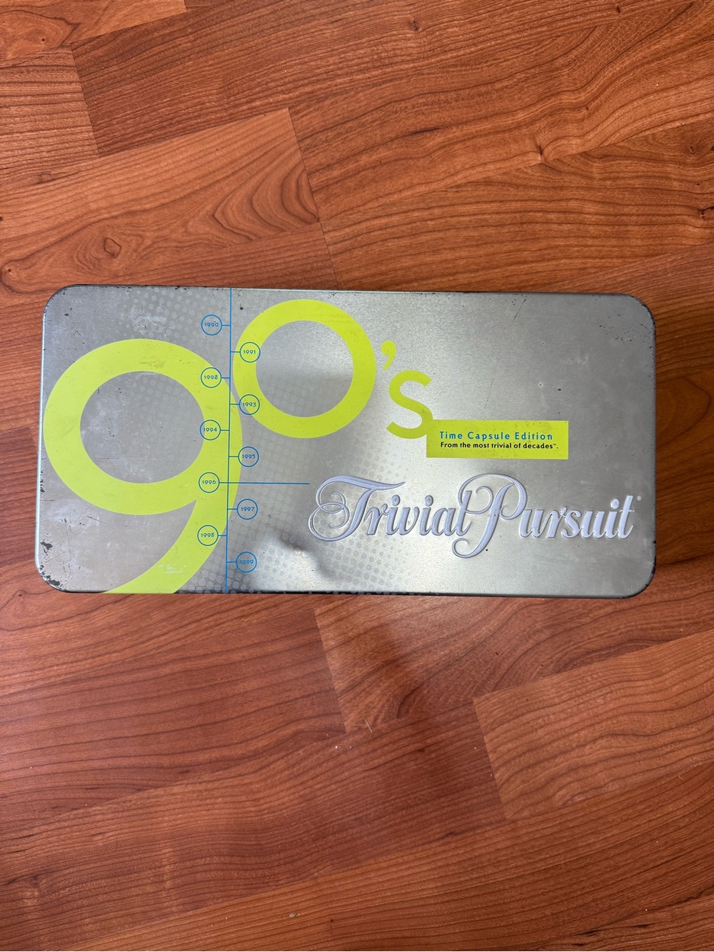 Hasbro Trivial Pursuit 90's Time Capsule Tin - Silver and Lime
